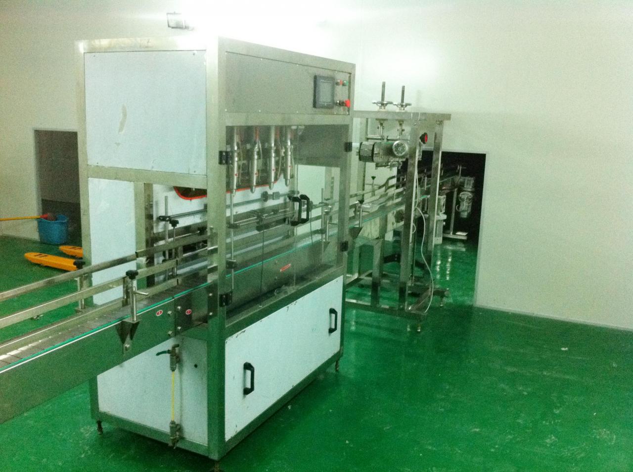 Linear filling machine with 4 filling heads 선형 충진기.jpg
