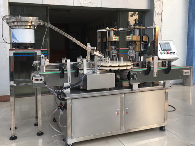 capping machine with 2 capping heads 스크류 캡퍼 장비 반자동.jpg